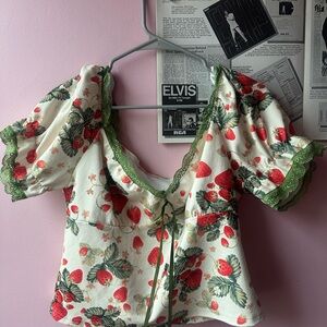 Strawberry print shirt with green lace trim